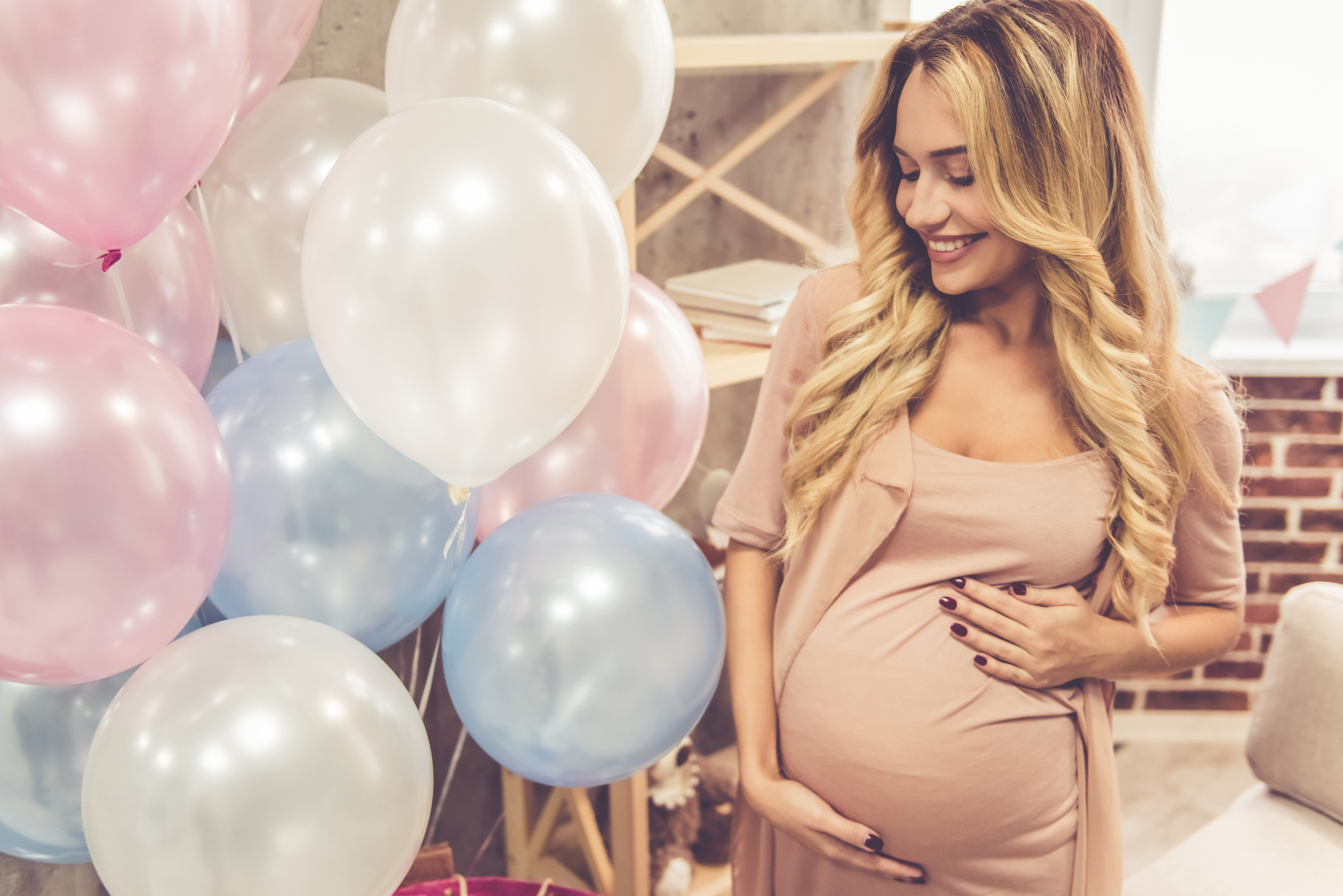 A stylish pregnant woman celebrate at her baby shower