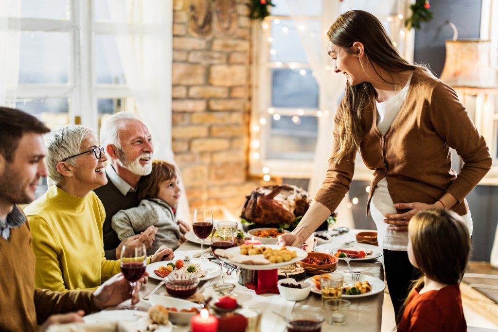 A happy, multi-generational family at Thanksgiving dinner