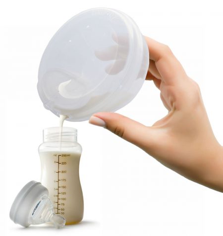 Pouring breast milk from the Freemie Independence Mobile Hands-Free breast pump