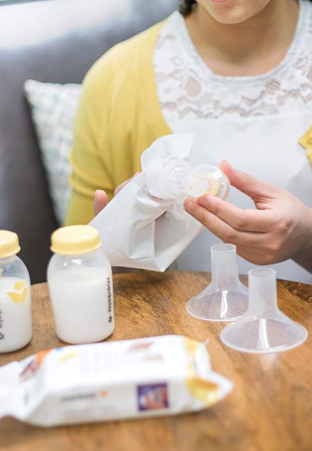 A woman cleans her breast pump