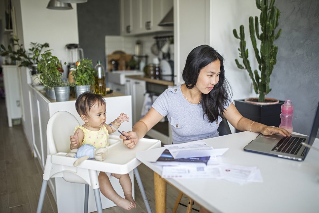 Mom Working and spending time with baby