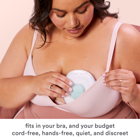 A woman inserts a Willow Go breast pump into her bra