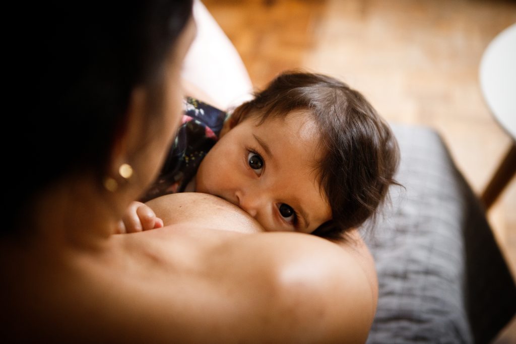 A mother breastfeeds her baby