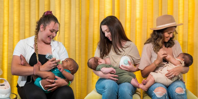 Three women breastfeed their babies