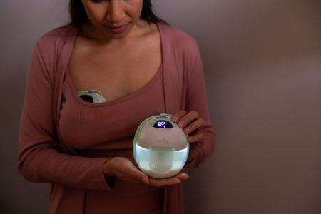 A mom showcasing the glow in the dark functionality of the Motif Aura Glow