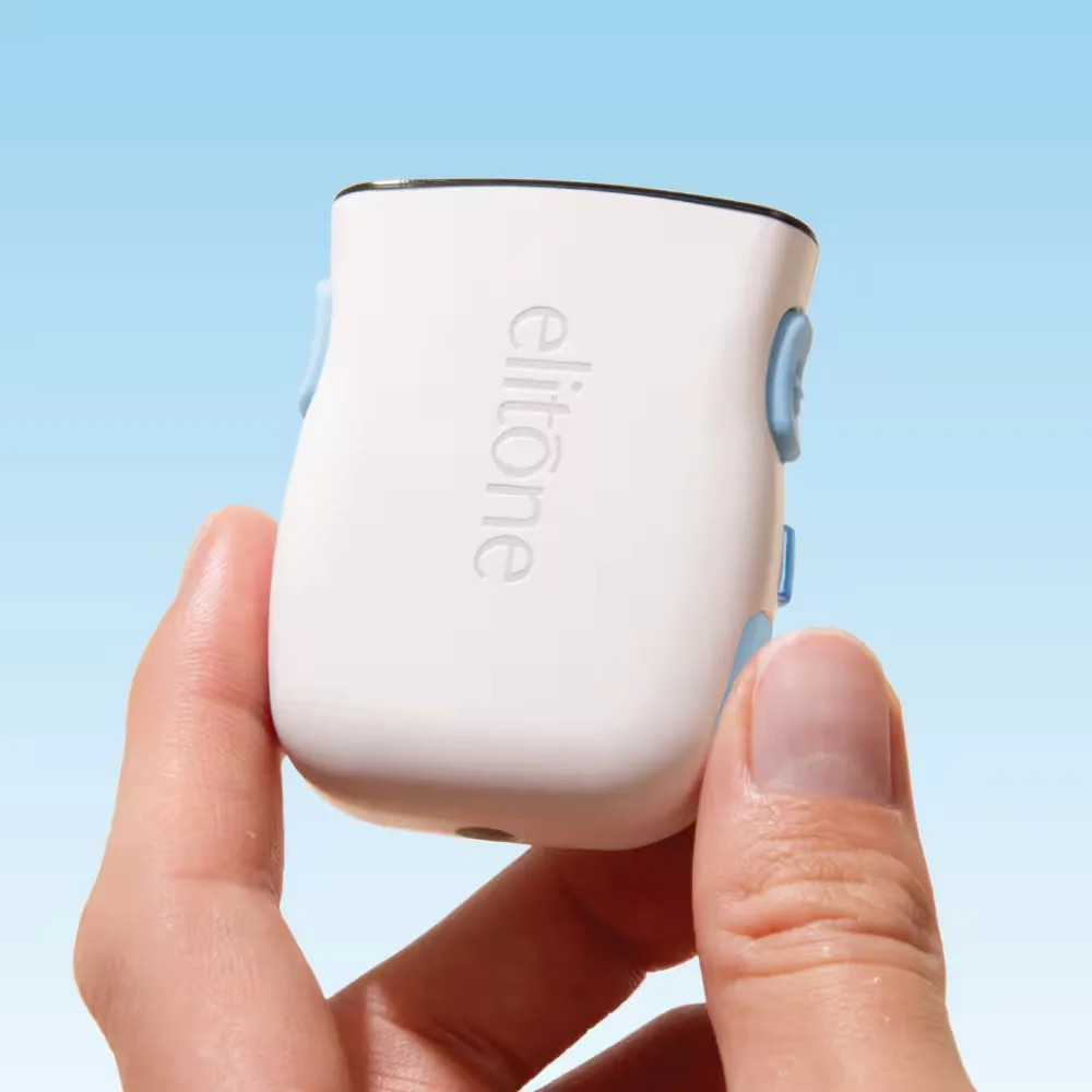 Hand holding the small white Elitone pelvic floor trainer controller