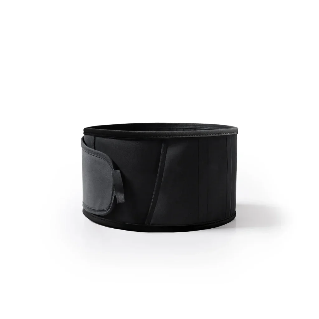 Black pregnancy support band fastened in a loop with its hook-and-loop closure